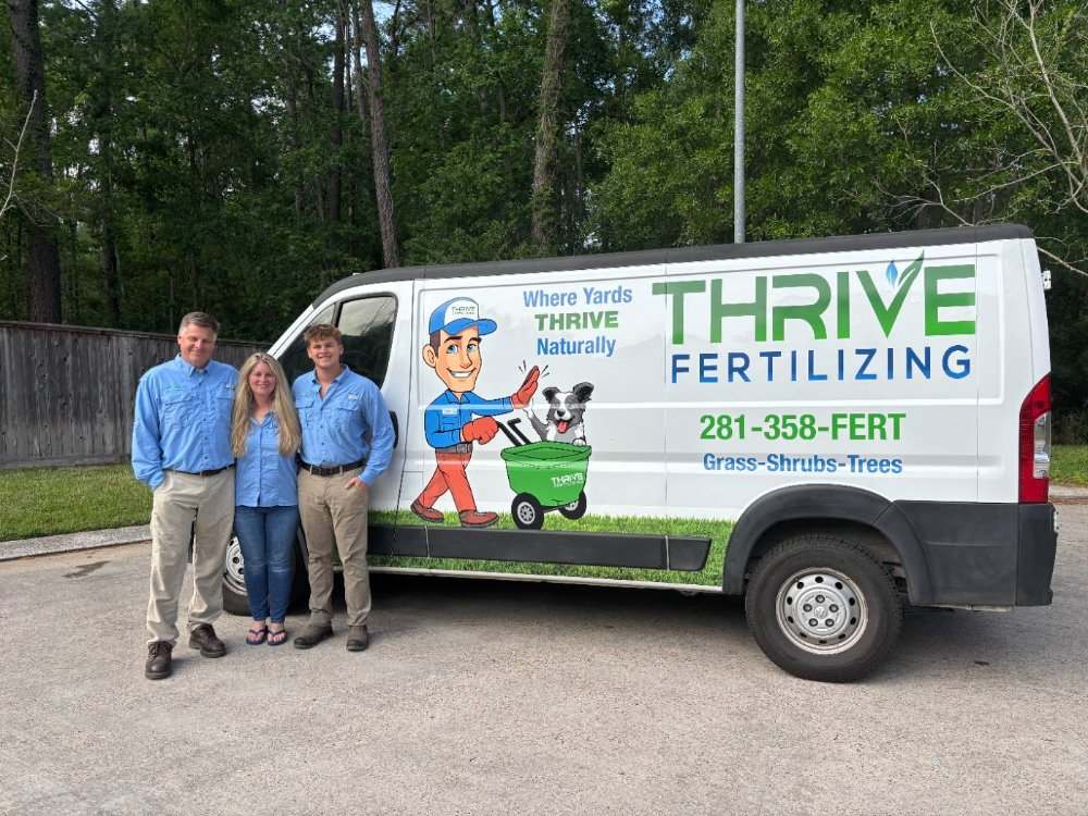 The Thrive Fertilizing family team beside the company van
